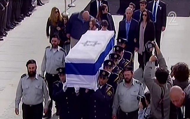 The casket of former premier Ariel Sharon is carried out of the Knesset plaza on Monday morning, January 13, 2014, after a memorial ceremony. (photo credit: screen shot/Channel 2)