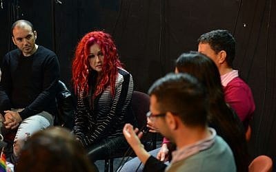 Lauper listening to the activists. (photo credit: courtesy image)