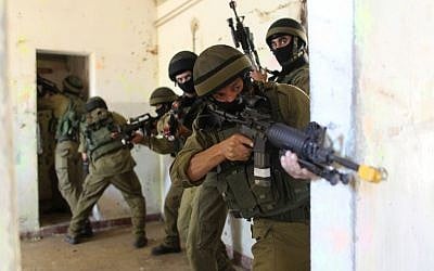 Israeli soldiers practice urban warfare on the Zeelim army base in southern Israel. (Nati Shohat/Flash90) Israeli soldiers practice urban warfare on the Zeelim army base in southern Israel. (Nati Shohat/Flash90)