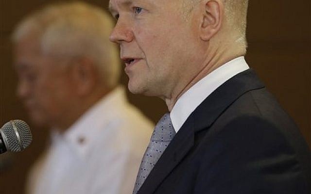 British Foreign Secretary William Hague answers questions from the media during a joint news conference with his Philippine counterpart Albert del Rosario, left, Thursday, Jan. 30, 2014 in Manila, Philippines. (photo credit: AP Photo/Bullit Marquez) British Foreign Secretary William Hague answers questions from the media during a joint news conference with his Philippine counterpart Albert del Rosario, left, Thursday, Jan. 30, 2014 in Manila, Philippines. (photo credit: AP Photo/Bullit Marquez)