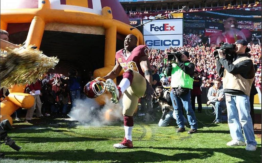 An enthusiastic London Fletcher being introduced as a starter for the Washington Redskins. He holds the NFL record for consecutive starts by a linebacker with 216 while playing for three teams. (photo credit: Courtesy Washington Redskins) An enthusiastic London Fletcher being introduced as a starter for the Washington Redskins. He holds the NFL record for consecutive starts by a linebacker with 216 while playing for three teams. (photo credit: Courtesy Washington Redskins)