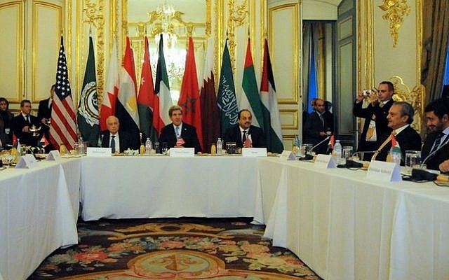 US Secretary of State John Kerry (center) looks out over a meeting of the Arab Peace Initiative in Paris, France, on January 12, 2014 (photo credit: US State Department official)
