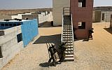 Israeli soldiers of the Paratroopers Brigade train in an urban warfare training at a training base, in southern Israel. (photo credit: Kobi Gideon / Flash90)