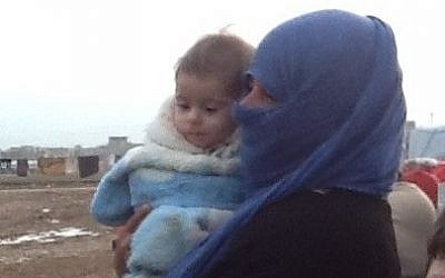 The child and her grandmother (photo credit: Times of Israel/Lazar Berman)
