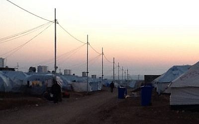 Sun sets behind a refugee camp in Iraqi Kurdistan (photo credit: Times of Israel/Lazar Berman)