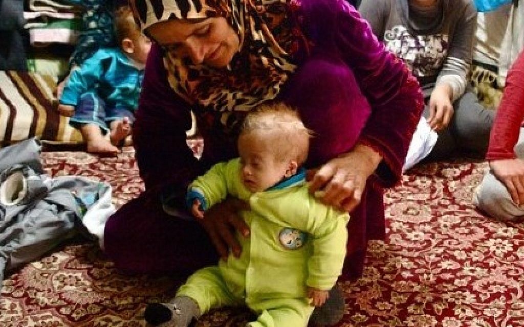 An emaciated child and her mother in the Kawargosk refugee camp (photo credit: courtesy/Kelsey Cannon)