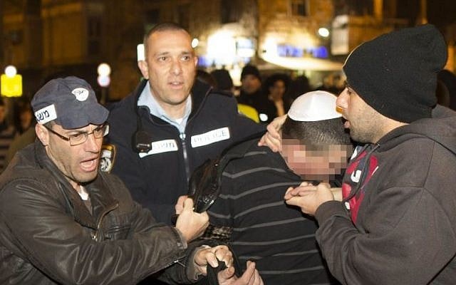 Police detain a protester during a protest at Bar Ilan intersection in Jerusalem on January 8, 2014. (photo credit: Yonatan Sindel/Flash90) Police detain a protester during a protest at Bar Ilan intersection in Jerusalem on January 8, 2014. (photo credit: Yonatan Sindel/Flash90)