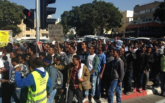 African asylum seekers marching along Allenby Street in Tel Aviv, Monday, January 6, 2014. (photo credit: The Times of Israel / Hannah Fink) African asylum seekers marching along Allenby Street in Tel Aviv, Monday, January 6, 2014. (photo credit: The Times of Israel / Hannah Fink)