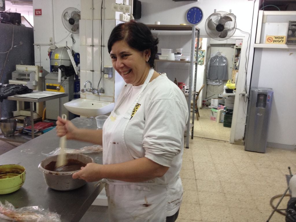 Galia Bertele working in her kitchen (photo credit: Jessica Steinberg/Times of Israel)