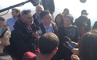 Interior Minister Gideon Sa'ar, flanked by MKs and deputy ministers, addresses reporters at the Yigal Allon lookout over the Jordan Valley, Thursday, January 2, 2014 (photo credit: Raphael Ahren/Times of Israel)