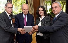 President Peres, flanked by MKs Nachman Shai and Ayelet Shaked, accepts a Knesset petition on behalf of Jonathan Pollard in 2014 (photo credit: Haim Zach, GPO)