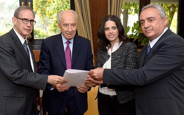 President Peres, flanked by MKs Nachman Shai and Ayelet Shaked, accepts a Knesset petition on behalf of Jonathan Pollard in 2014 (photo credit: Haim Zach, GPO) President Peres, flanked by MKs Nachman Shai and Ayelet Shaked, accepts a Knesset petition on behalf of Jonathan Pollard in 2014 (photo credit: Haim Zach, GPO)