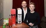 Scarlett Johansson with Sodastream's Daniel Birnbaum (photo credit: Mike Coppola/Getty Images for SodaStream/via JTA)