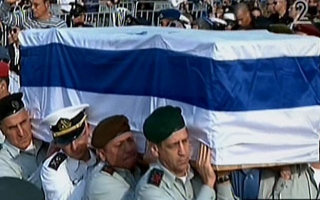 IDF major generals shoulder the casket of former prime minister Ariel Sharon in the Sycamore Ranch, Sunday, January 13, 2014 (screen capture: Channel 2)
