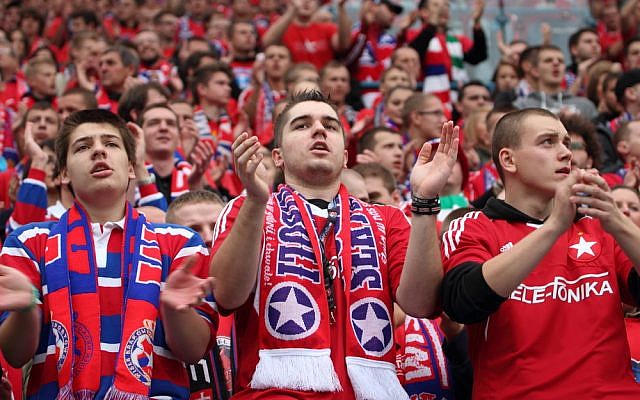 Soccer fans at a match in Krakow, Poland on October 6, 2013. (soccer fan image via Shutterstock) Soccer fans at a match in Krakow, Poland on October 6, 2013. (soccer fan image via Shutterstock)