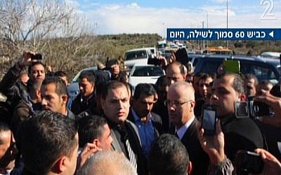 PA Prime Minister Rami Hamdallah, center right, after his convoy was pulled over by Israeli police for speeding, Tuesday, January 14, 2014 (screen capture: Channel 2)