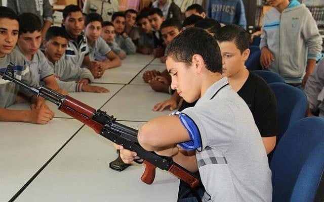A child practices disassembling an AK-47 during the Hamas-run 'pioneers of liberation' camps in Gaza (photo credit: Hamas interior ministry website) A child practices disassembling an AK-47 during the Hamas-run 'pioneers of liberation' camps in Gaza (photo credit: Hamas interior ministry website)