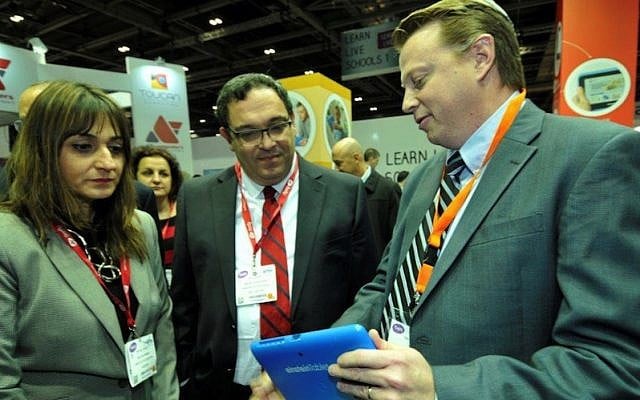 Education Minister Director Michal Cohen (L.) and Education Minister Shai Piron (C.) look on as Fourier CEO Ken Zwiebel demonstrates an Einstein tablet+ at the Bett Show in London last week (Photo credit: Courtesy) Education Minister Director Michal Cohen (L.) and Education Minister Shai Piron (C.) look on as Fourier CEO Ken Zwiebel demonstrates an Einstein tablet+ at the Bett Show in London last week (Photo credit: Courtesy)