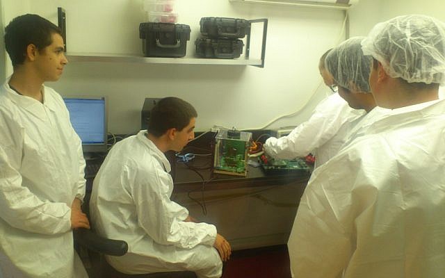 Students work on the Duchifat cubesat (Photo credit: Courtesy) Students work on the Duchifat cubesat (Photo credit: Courtesy)