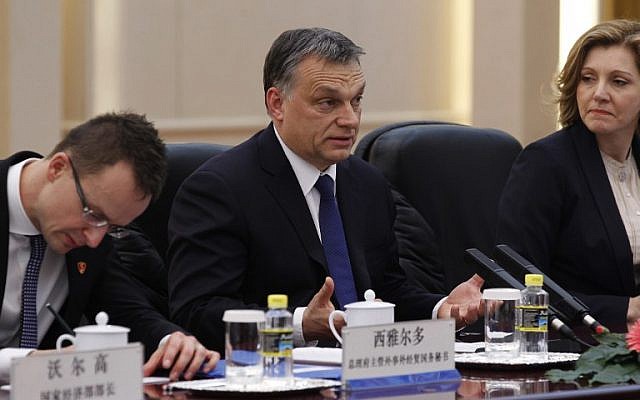 Hungarian Prime Minister Viktor Orban (center) during a trip to China on February 13, 2014. (photo credit: AFP/ROLEX DELA PENA Hungarian Prime Minister Viktor Orban (center) during a trip to China on February 13, 2014. (photo credit: AFP/ROLEX DELA PENA