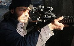 A rebel fighter scans the area with the scope of his rifle as he holds a position in the northern Syrian city of Aleppo on February 11, 2014 (photo credit: AFP/Aleppo Media Center/Fadi al-Halabi)