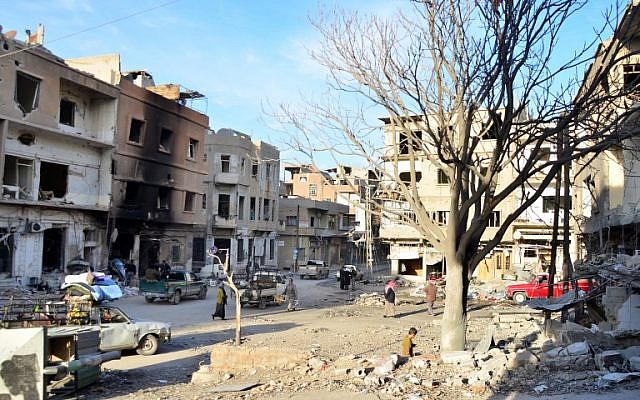People walk in Yabrud, north of Damascus, on February 21, 2014. (Photo credit: AFP/ALI DIAB)