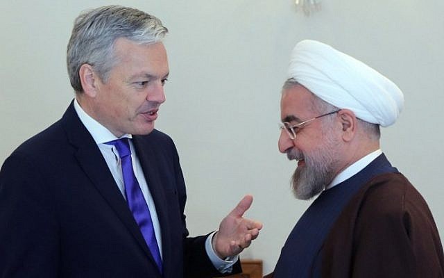 Iranian President Hassan Rouhani (R) welcomes Belgian Foreign Minister Didier Reynders in Tehran on February 23, 2014. (photo credit: AFP photo/Atta Kenare) Iranian President Hassan Rouhani (R) welcomes Belgian Foreign Minister Didier Reynders in Tehran on February 23, 2014. (photo credit: AFP photo/Atta Kenare)