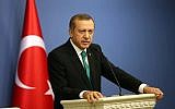 Turkish Prime Minister Recep Tayyip Erdogan speaks during a press conference on Tuesday, February 11, 2014 (photo credit: AFP/Adem Altan)