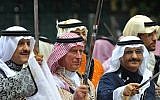 Britain's Prince Charles (C) wears traditional Saudi uniform as he participates inan  "Ardah" sword dance in Saudi Arabia in 2014. (AFP/Pool/Fayez Nureldine)