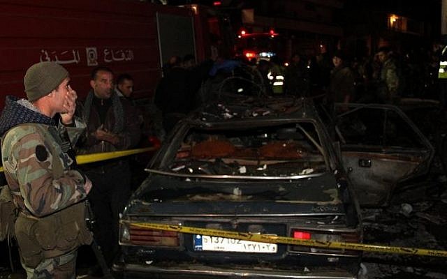 Lebanese emergency personnel at the site of a car bomb explosion targeting a petrol station in Hermel, Lebanon, Saturday, February 1, 2014 (photo credit: AFP) Lebanese emergency personnel at the site of a car bomb explosion targeting a petrol station in Hermel, Lebanon, Saturday, February 1, 2014 (photo credit: AFP)