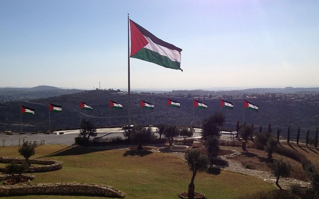 Palestinian flags encircle Rawabi's visitors' center (photo credit: Elhanan Miller/Times of Israel)