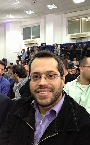 Beit Berl student Ophir Rosensaft awaits Abbas's speech at the Muqataa in Ramallah (photo credit: Elhanan Miller/Times of Israel)