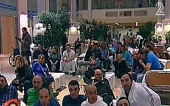Hadassah workers prepare to spend the night at the Ein Kerem hospital in Jerusalem, Tuesday, February 18, 2014 (screen capture: Channel 2)