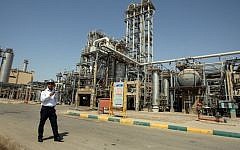 An Iranian security guard stands at the Maroun petrochemical plant at the Imam Khomeini port, southwestern Iran. (AP/Vahid Salemi, File)