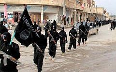 This undated file image posted on a militant website on, January 14, 2014, shows fighters from the al-Qaeda linked Islamic State of Iraq and the Levant (ISIS) marching in Syria. (AP)