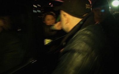 In this image made from video distributed by AP Video, former Prime Minister Yulia Tymoshenko, is seen waving out of the window of a car as she leaves hospital after the Ukrainian Parliament arranged for her release from prison, Kharkiv, Ukraine, Saturday, Feb. 22, 2014. (photo credit: AP/AP Video)