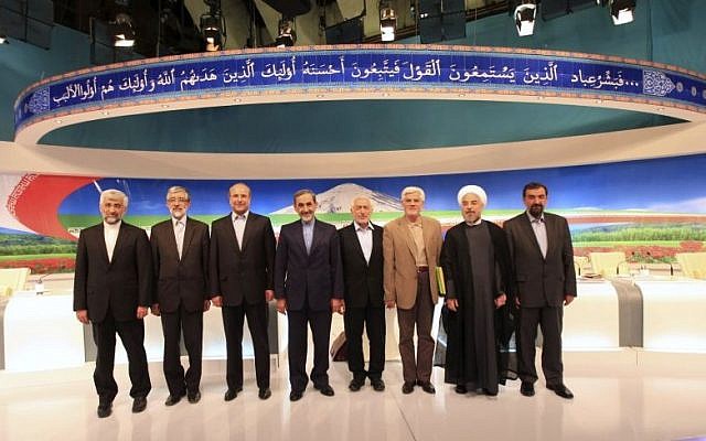 In this photo released by the Islamic Republic of Iran Broadcasting (IRIB), May 31, 2013, then presidential candidates from left, Saeed Jalili, Gholam Ali Haddad Adel, Mohammad Bagher Qalibaf, Ali Akbar Velayati, Mohammad Gharazi, Mohammad Reza Aref, Hassan Rouhani, Mohsen Rezaei, pose for a group picture, after their TV debate in a state-run TV studio, in Tehran. (photo credit: AP Photo/Islamic Republic of Iran Broadcasting, Mehdi Dehghan) In this photo released by the Islamic Republic of Iran Broadcasting (IRIB), May 31, 2013, then presidential candidates from left, Saeed Jalili, Gholam Ali Haddad Adel, Mohammad Bagher Qalibaf, Ali Akbar Velayati, Mohammad Gharazi, Mohammad Reza Aref, Hassan Rouhani, Mohsen Rezaei, pose for a group picture, after their TV debate in a state-run TV studio, in Tehran. (photo credit: AP Photo/Islamic Republic of Iran Broadcasting, Mehdi Dehghan)