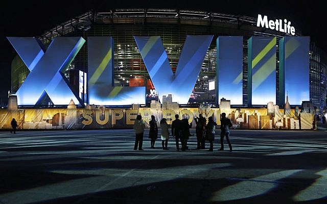Fans walk near MetLife Stadium before the NFL Super Bowl XLVIII football game between the Seattle Seahawks and the Denver Broncos Sunday, Feb. 2, 2014. (photo credit: AP/Seth Wenig) Fans walk near MetLife Stadium before the NFL Super Bowl XLVIII football game between the Seattle Seahawks and the Denver Broncos Sunday, Feb. 2, 2014. (photo credit: AP/Seth Wenig)