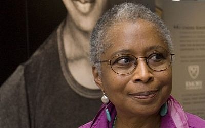 In this April 23, 2009 file photo, Alice Walker stands in front of a picture of herself from 1974 as she tours her archives at Emory University, in Atlanta. (AP Photo/John Amis)