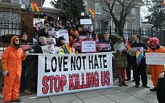 Protesters denounce Uganda’s anti-gay policies in front of its embassy in Washington, Feb. 10 2014. (Suzanne Pollak/JTA)