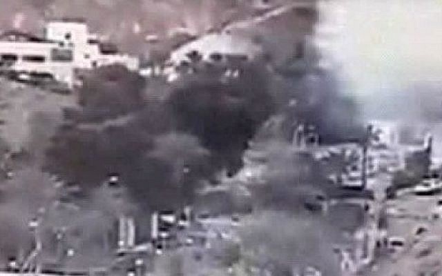 An image made from a video provided by the Israeli Airports Authority shows smoke, white area at upper right,. from the bombing of the bus carrying South Korean sightseers near the tip of the Red Sea's Gulf of Aqaba Sunday Feb. 16, 2014. (photo credit: AP Photo/Israeli Airports Authority) An image made from a video provided by the Israeli Airports Authority shows smoke, white area at upper right,. from the bombing of the bus carrying South Korean sightseers near the tip of the Red Sea's Gulf of Aqaba Sunday Feb. 16, 2014. (photo credit: AP Photo/Israeli Airports Authority)