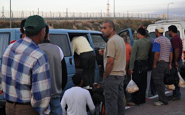 Palestinian workers in 2009, having crossed through Maccabim checkpoint on foot, en route to jobs in Israel (photo credit: Jorge Novominsky/ Flash 90) Palestinian workers in 2009, having crossed through Maccabim checkpoint on foot, en route to jobs in Israel (photo credit: Jorge Novominsky/ Flash 90)