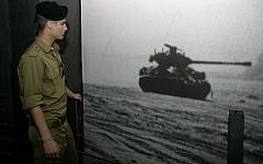 A soldier at the Armored Corps Memorial Site and Museum in Latrun, Israel on April 18,2010 (photo credit: Abir Sultan/Flash 90)