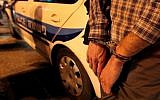Illustrative photo of a man being arrested. (photo credit: Abir Sultan/Flash90)