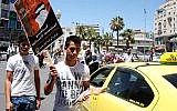 Palestinians protesters call for a boycott of Israeli products (illustrative photo: Issam Rimawi/Flash90)