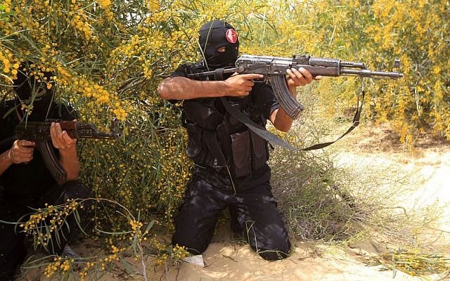 Palestinian militants of the Popular Front for the Liberation of Palestine (PFLP) display their skills to the media during a graduation ceremony in Khan Yunis, southern Gaza Strip on March 13, 2013. (photo credit: Abed Rahim Khatib/Flash90) Palestinian militants of the Popular Front for the Liberation of Palestine (PFLP) display their skills to the media during a graduation ceremony in Khan Yunis, southern Gaza Strip on March 13, 2013. (photo credit: Abed Rahim Khatib/Flash90)