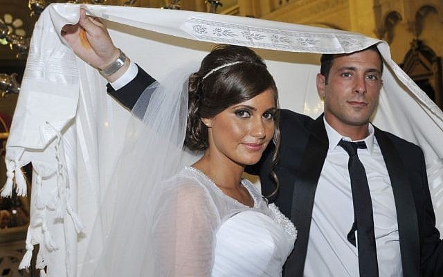 A Jewish couple stand underneath the huppa. (Illustrative photo: Serge Attal/FLASH90)
