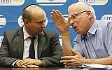 Naftali Bennett (L), leader of the Jewish Home party, seen with fellow Jewish Home minister MK Uri Ariel (photo credit: Miriam Alster/Flash90)