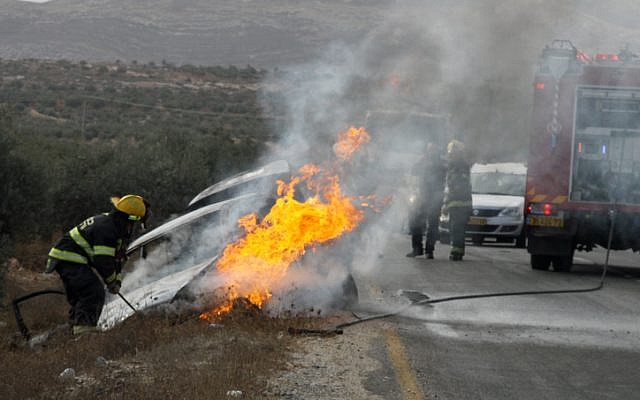 A car hit by a Molotov cocktail outside Tekoa in November 2013. A mother and child were wounded in the attack (photo credit: Gershon Elinson/ Flash 90) A car hit by a Molotov cocktail outside Tekoa in November 2013. A mother and child were wounded in the attack (photo credit: Gershon Elinson/ Flash 90)