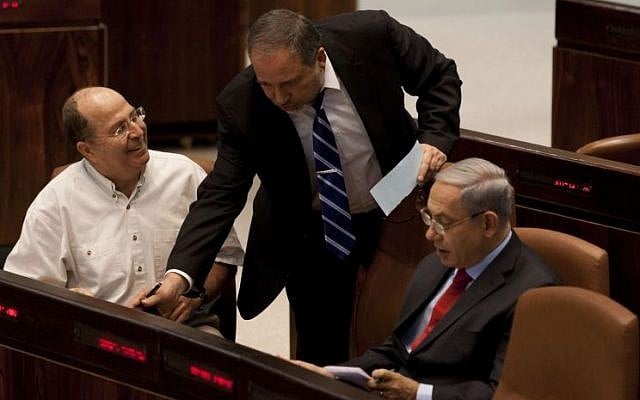 Prime minister Benjamin Netanyahu (R), Defense Minister Moshe Ya'alon (L) and Foreign Minister Avigdor Liberman in the Knesset, November 13, 2013. (Photo credit: Flash 90) Prime minister Benjamin Netanyahu (R), Defense Minister Moshe Ya'alon (L) and Foreign Minister Avigdor Liberman in the Knesset, November 13, 2013. (Photo credit: Flash 90)